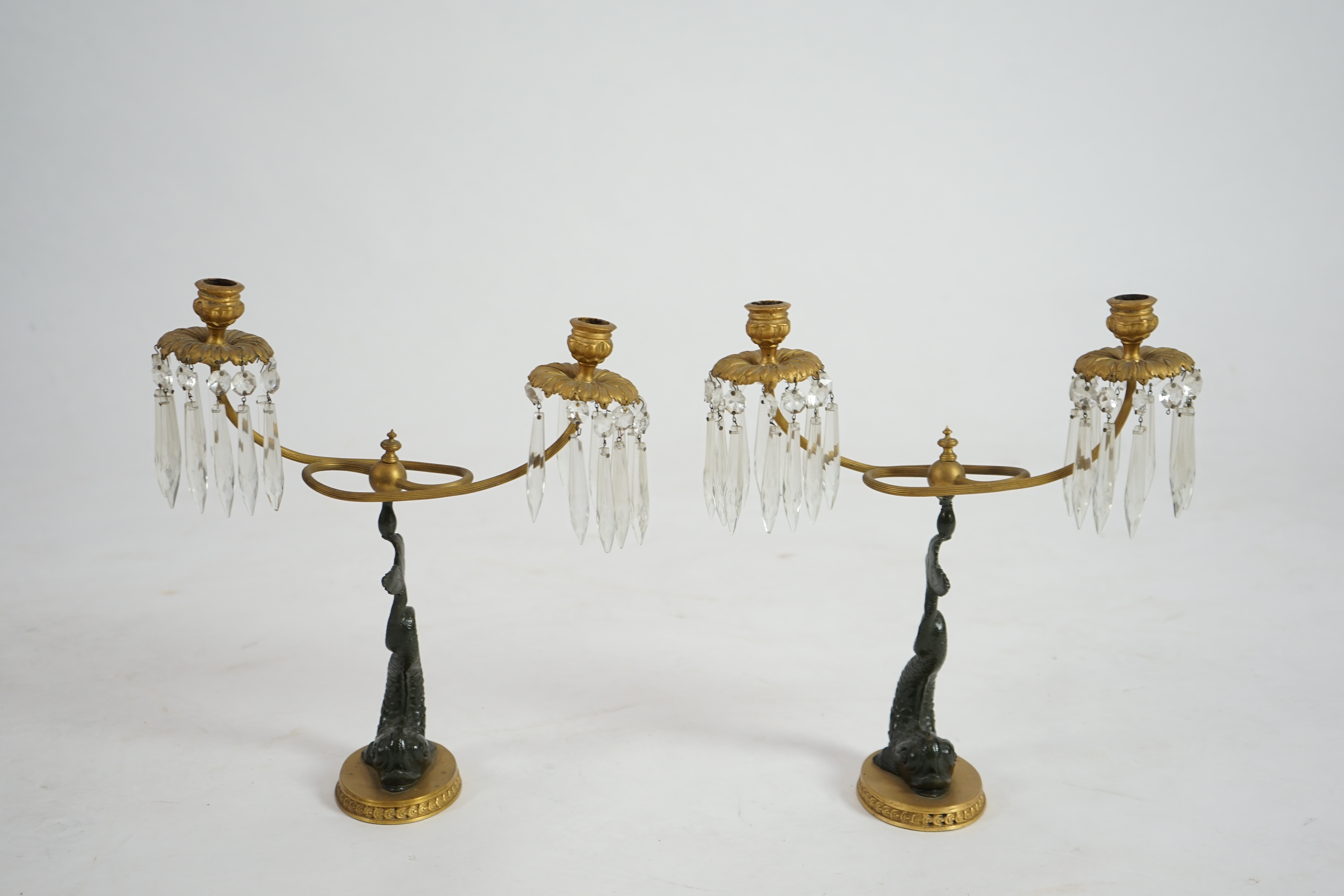 A pair of 19th century bronze and ormolu twin sconce candelabra